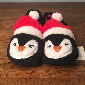 Women’s size 7 penguin slippers.